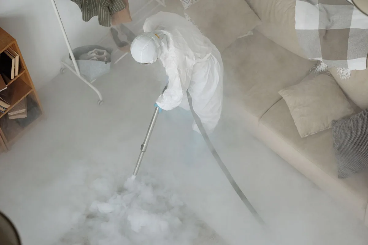 Biohazard cleanup technician in protective equipment, Cumberland Center, ME